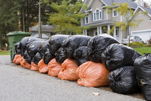 Eco-friendly rubbish removal truck in action